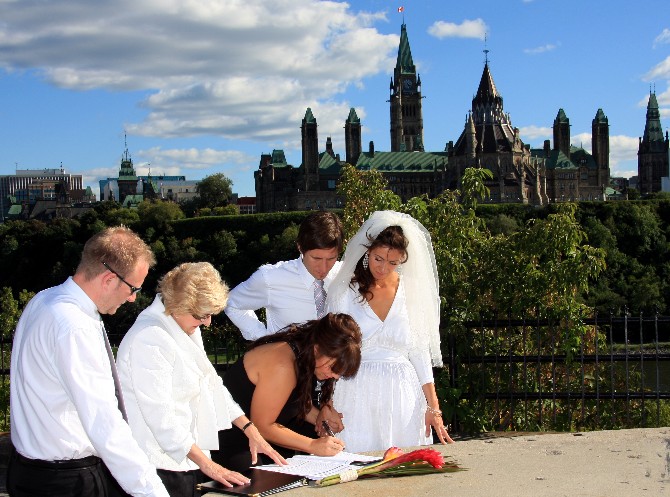 Lynne Langille performing  elopement ceremony at Nepean Point in Ottawa. Copyright 2010.